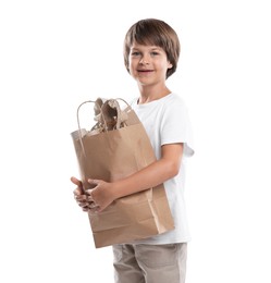 Photo of Recycling. Cute little boy with bag full of different waste paper on white background