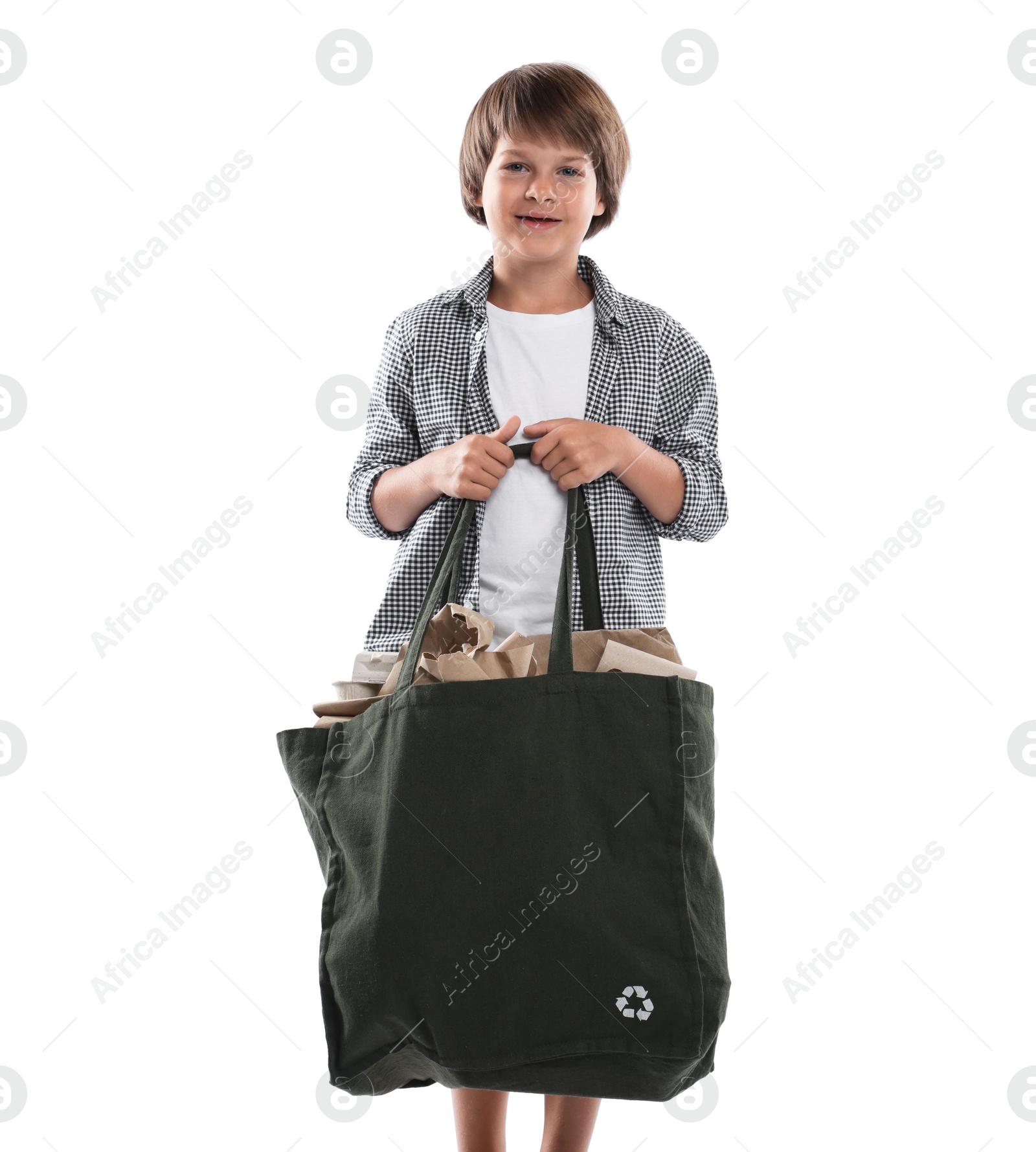 Photo of Recycling. Cute little boy with bag full of different waste paper on white background