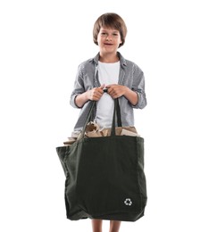 Photo of Recycling. Cute little boy with bag full of different waste paper on white background