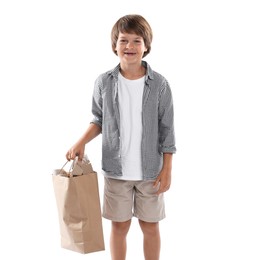 Photo of Recycling. Cute little boy with bag full of different waste paper on white background