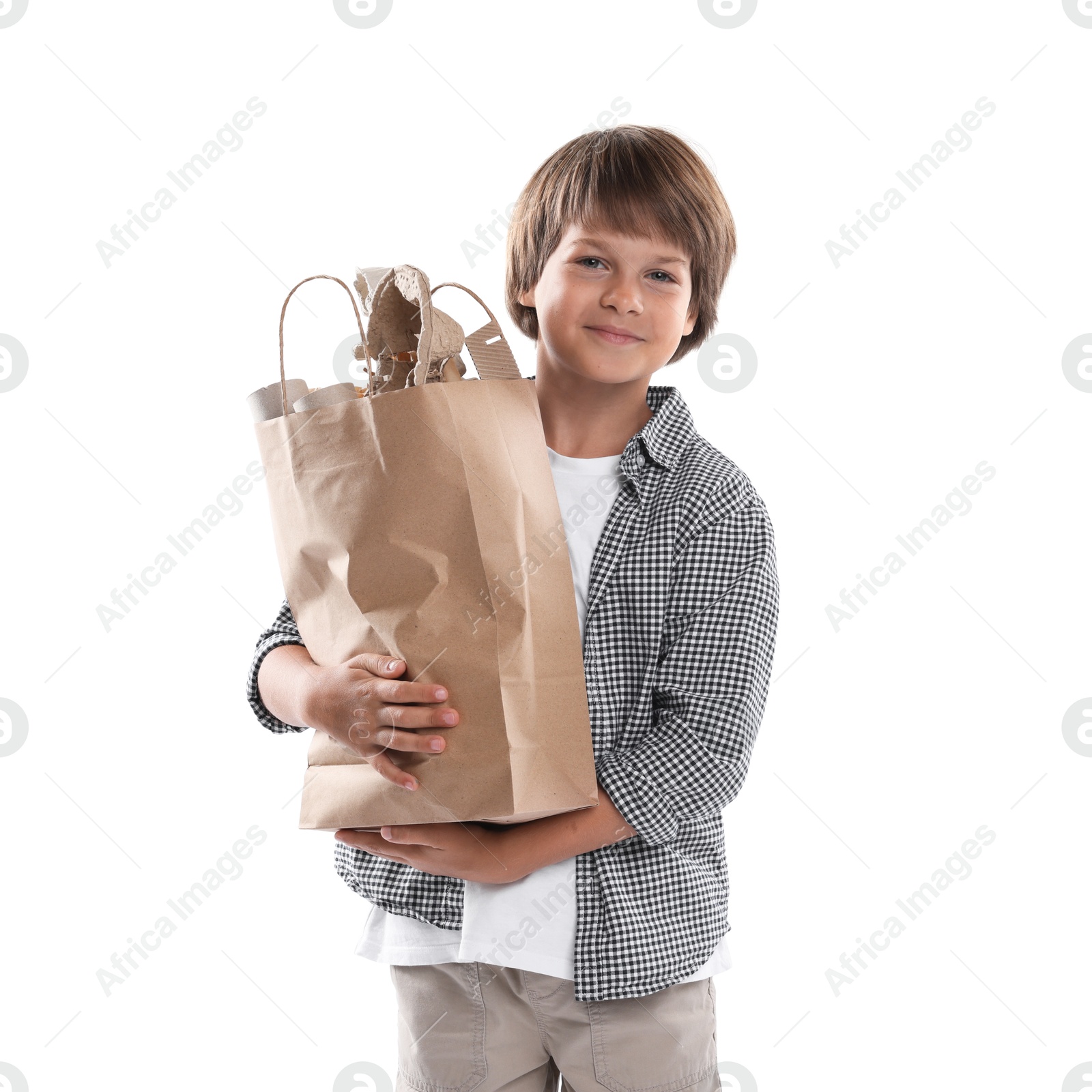 Recycling. Cute little boy with bag full of different waste paper on white background Photo of Recycling. Cute little boy with bag full of different waste paper on white background
