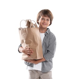 Photo of Recycling. Cute little boy with bag full of different waste paper on white background