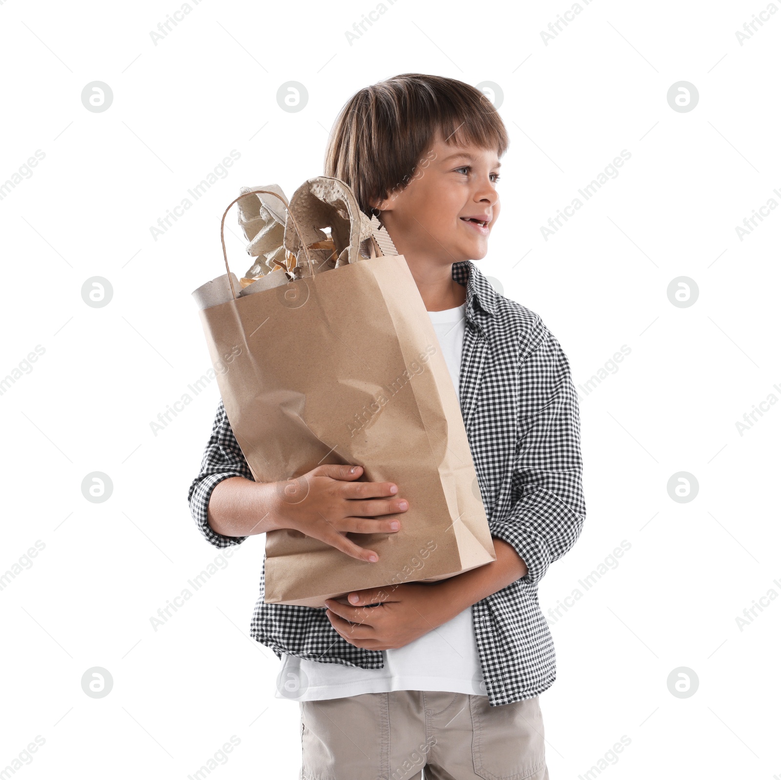 Recycling. Cute little boy with bag full of different waste paper on white background Photo of Recycling. Cute little boy with bag full of different waste paper on white background