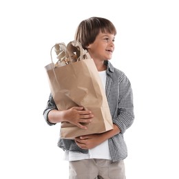 Photo of Recycling. Cute little boy with bag full of different waste paper on white background