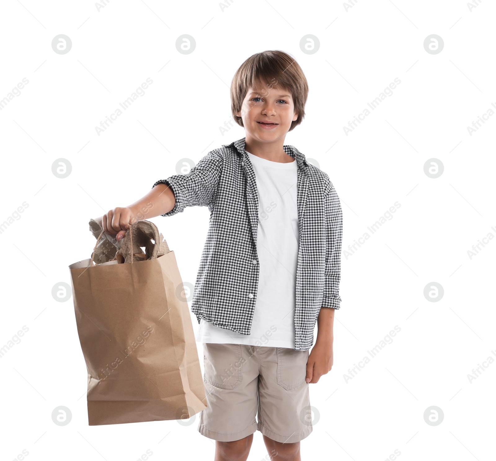 Recycling. Cute little boy with bag full of different waste paper on white background Photo of Recycling. Cute little boy with bag full of different waste paper on white background