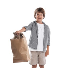 Photo of Recycling. Cute little boy with bag full of different waste paper on white background