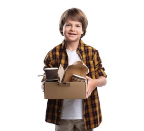 Photo of Recycling. Cute little boy with cardboard box full of different waste paper on white background