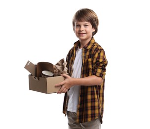 Photo of Recycling. Cute little boy with cardboard box full of different waste paper on white background