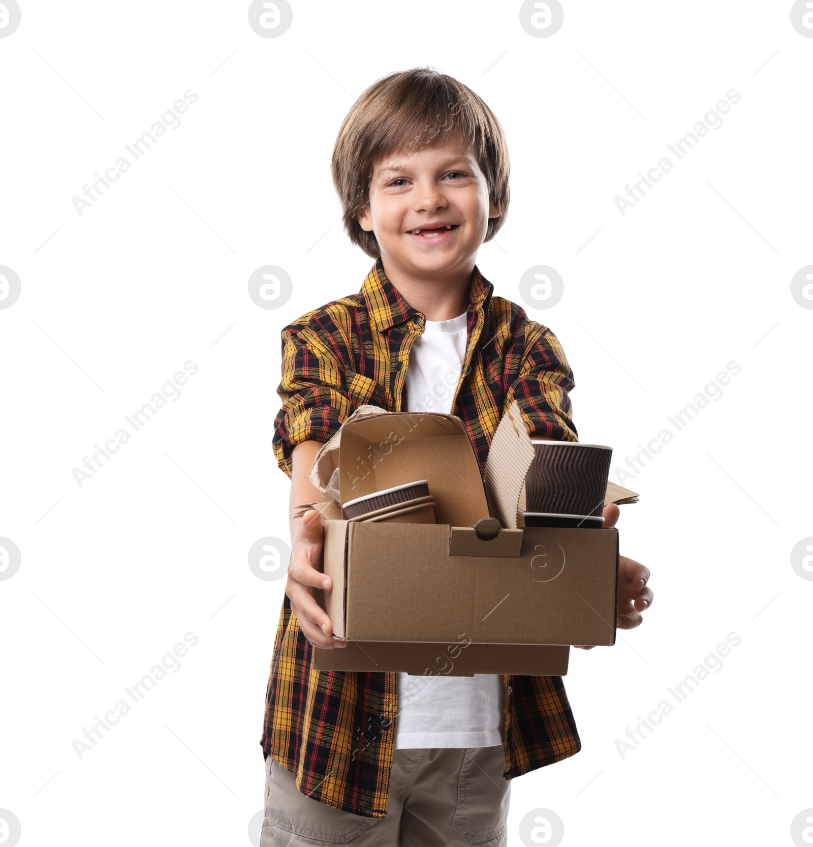 Photo of Recycling. Cute little boy with cardboard box full of different waste paper on white background
