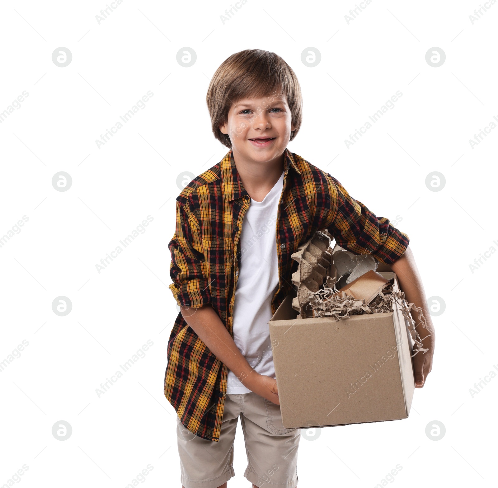 Recycling. Cute little boy with cardboard box full of different waste paper on white background Photo of Recycling. Cute little boy with cardboard box full of different waste paper on white background