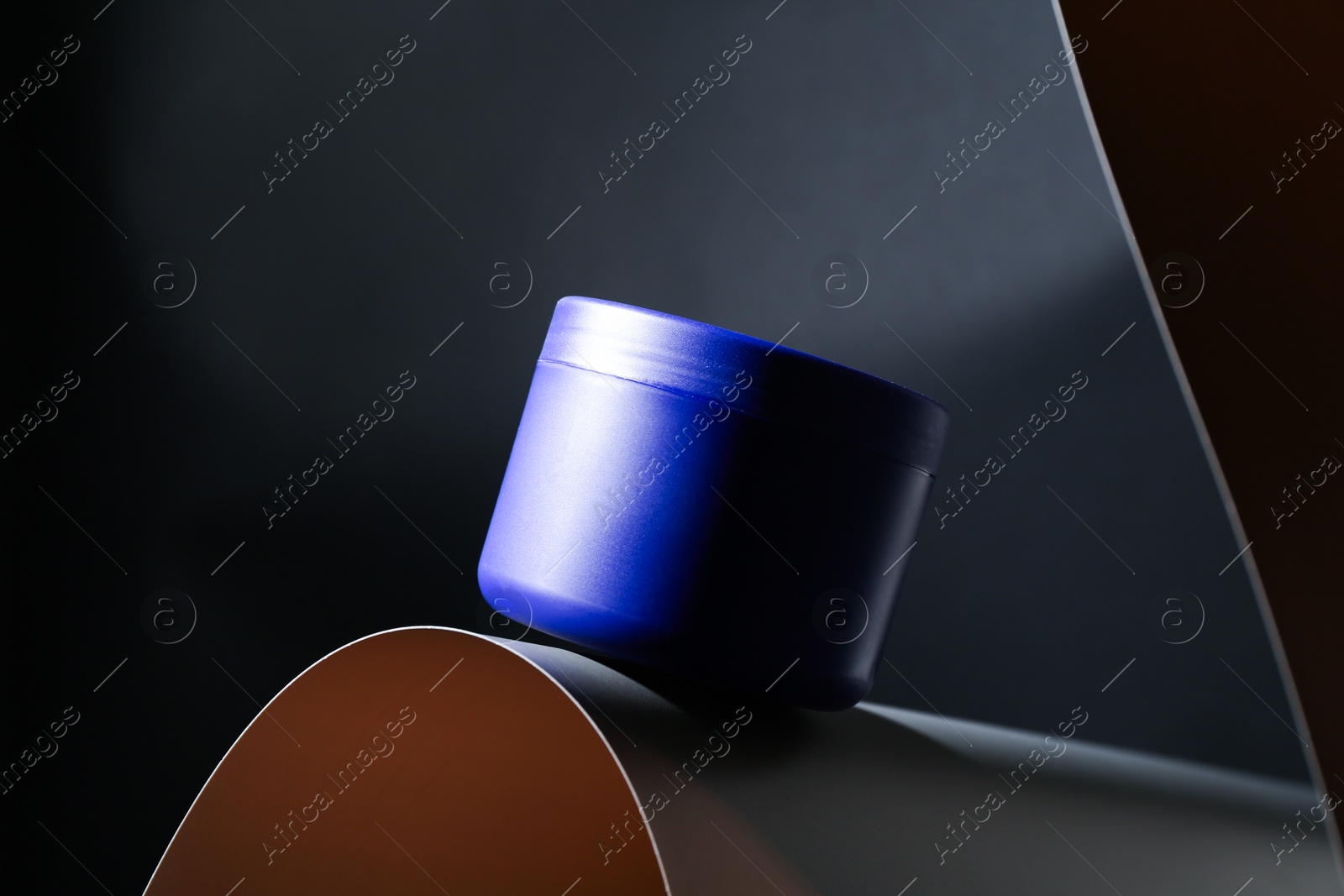 Jar of hair care cosmetic product for blonde hair on black background Photo of Jar of hair care cosmetic product for blonde hair on black background