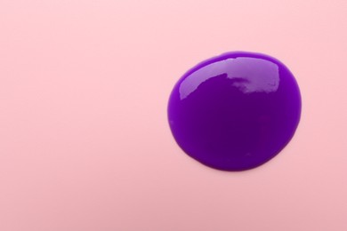 Photo of Sample of blonde hair care cosmetic product on pink background, top view. Space for text