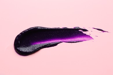 Photo of Sample of blonde hair care cosmetic product on pink background, top view