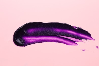 Photo of Sample of blonde hair care cosmetic product on pink background, top view