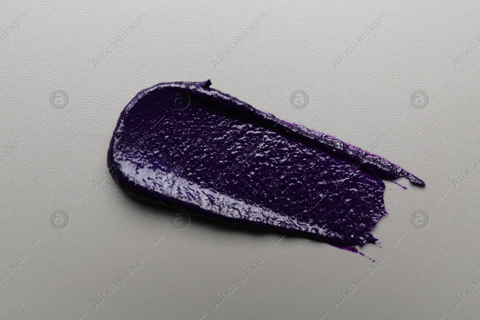 Sample of blonde hair care cosmetic product on grey background, top view Photo of Sample of blonde hair care cosmetic product on grey background, top view