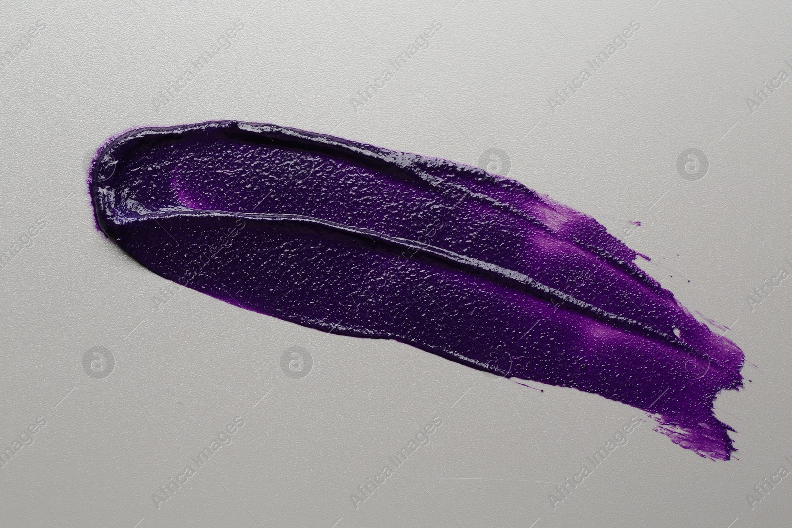Sample of blonde hair care cosmetic product on grey background, top view Photo of Sample of blonde hair care cosmetic product on grey background, top view