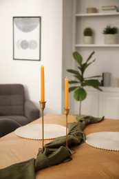 Photo of Decorated wooden table with chairs in dining room, closeup