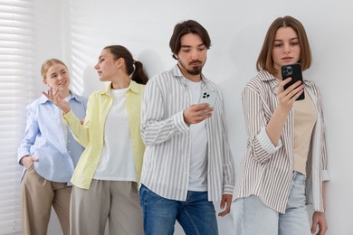 Photo of Group of people waiting in queue indoors