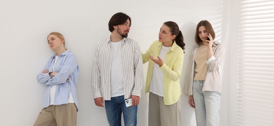 Photo of Group of people waiting in queue indoors