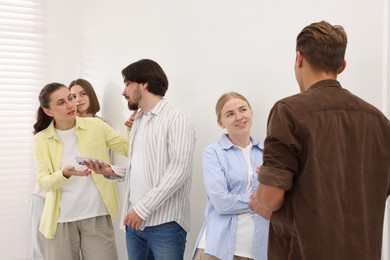 Photo of Group of people waiting in queue indoors