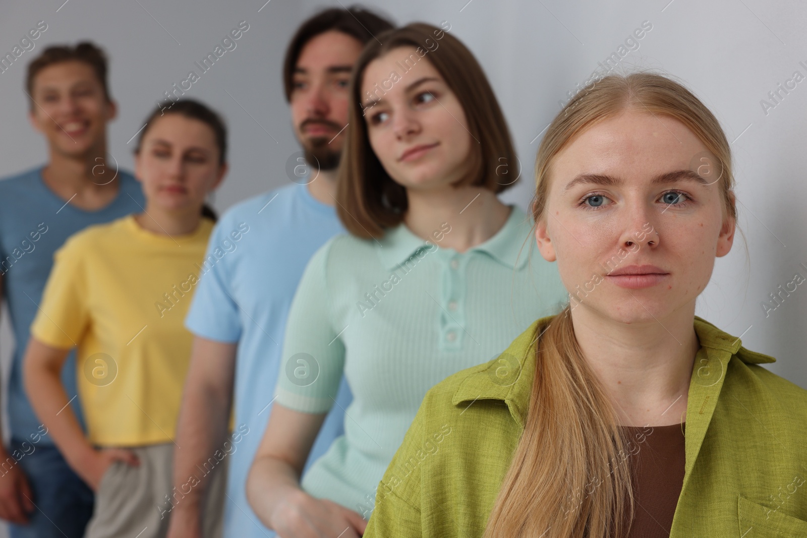 Group of people waiting in queue indoors, selective focus Photo of Group of people waiting in queue indoors, selective focus