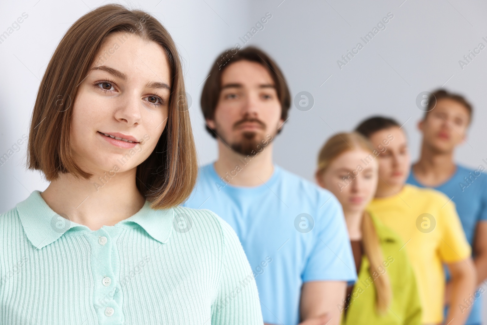 Group of people waiting in queue indoors, selective focus Photo of Group of people waiting in queue indoors, selective focus