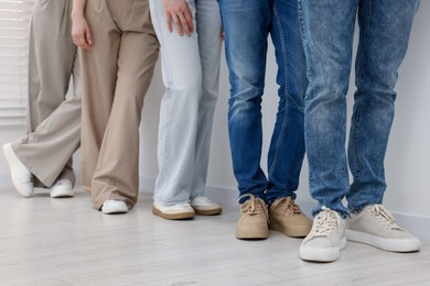 Photo of Group of people waiting in queue indoors, closeup