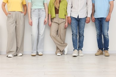 Photo of Group of people waiting in queue indoors, closeup