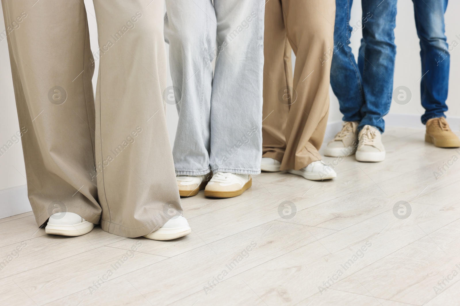 Group of people waiting in queue indoors, closeup Photo of Group of people waiting in queue indoors, closeup