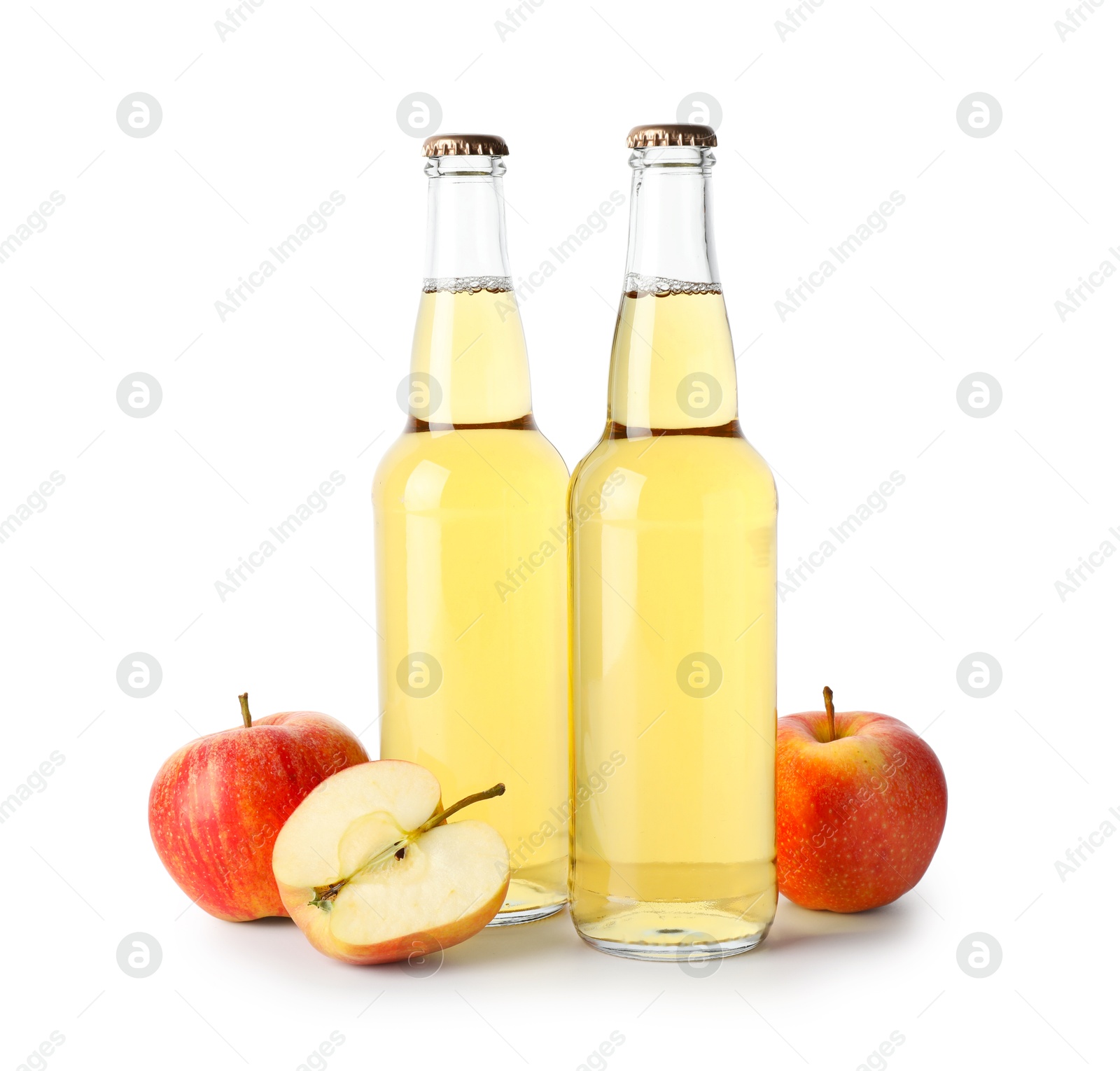 Photo of Delicious cider in glass bottles and apples isolated on white