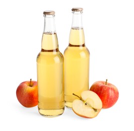 Photo of Delicious cider in glass bottles and apples isolated on white