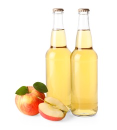 Photo of Delicious cider in glass bottles and apples isolated on white