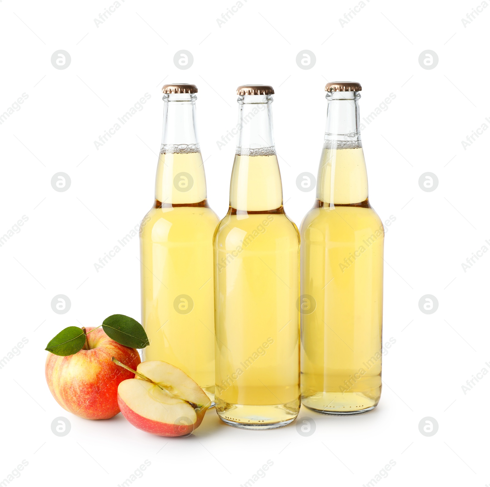 Photo of Delicious cider in glass bottles and apples isolated on white