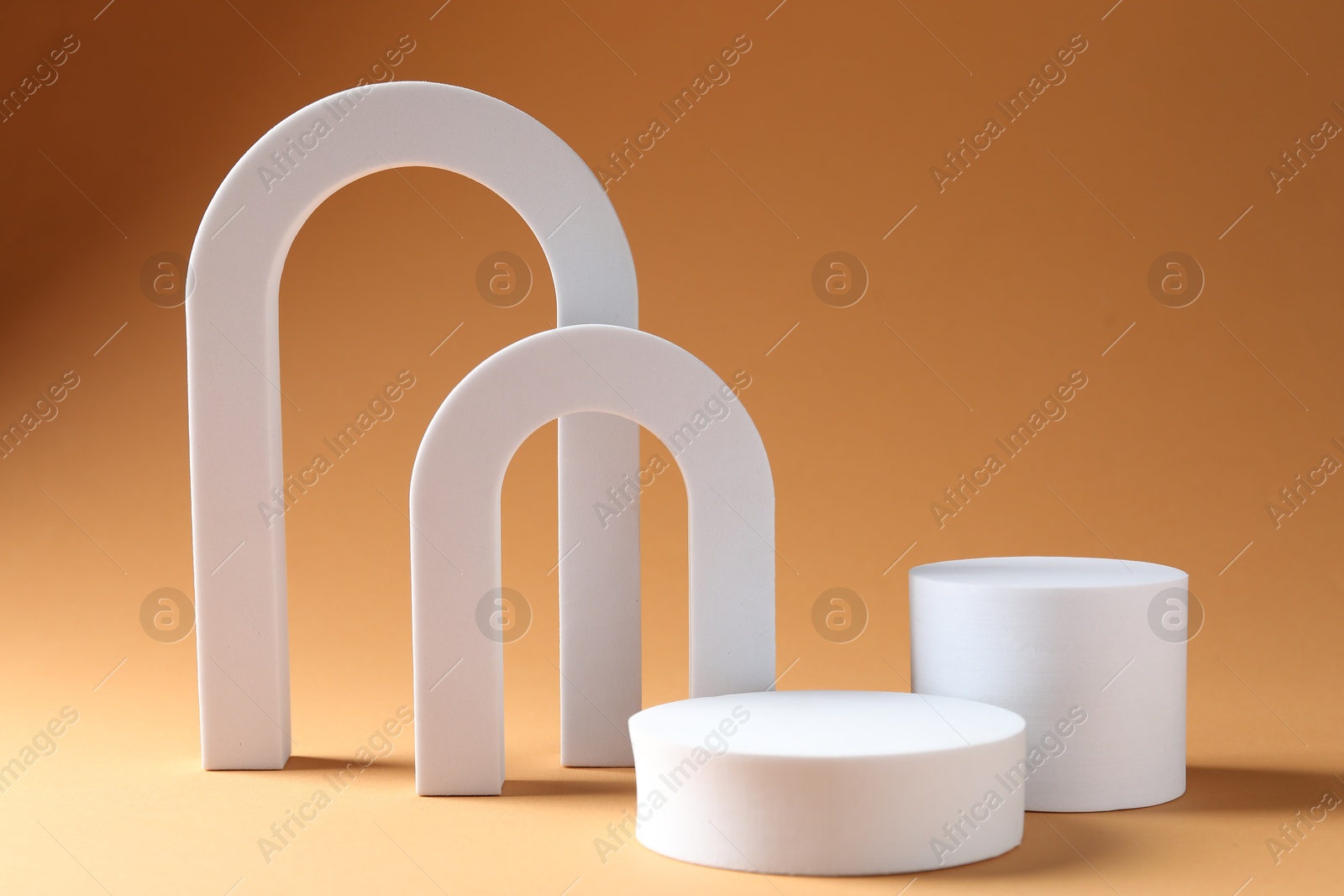 Photo of Promotion. Podiums for product presentation on beige background