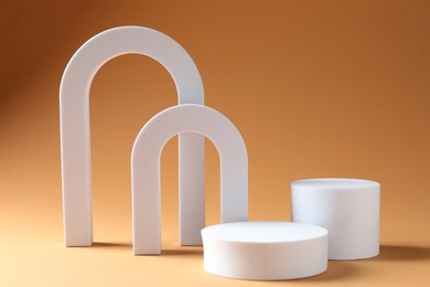Photo of Promotion. Podiums for product presentation on beige background
