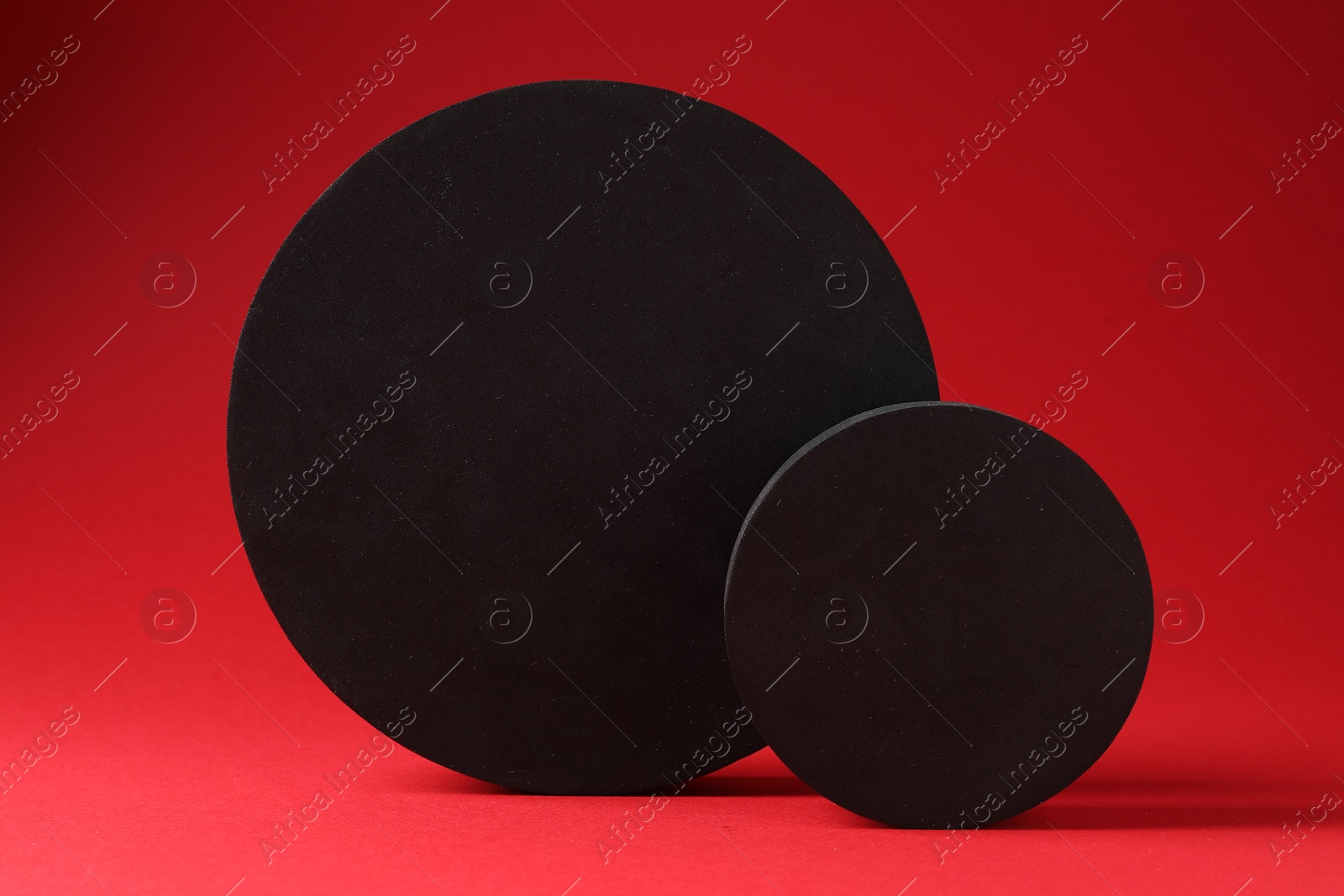 Photo of Promotion. Two black figures on red background