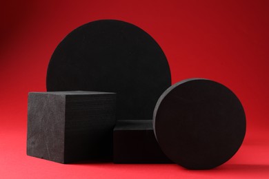 Photo of Promotion. Different podiums for product presentation on red background