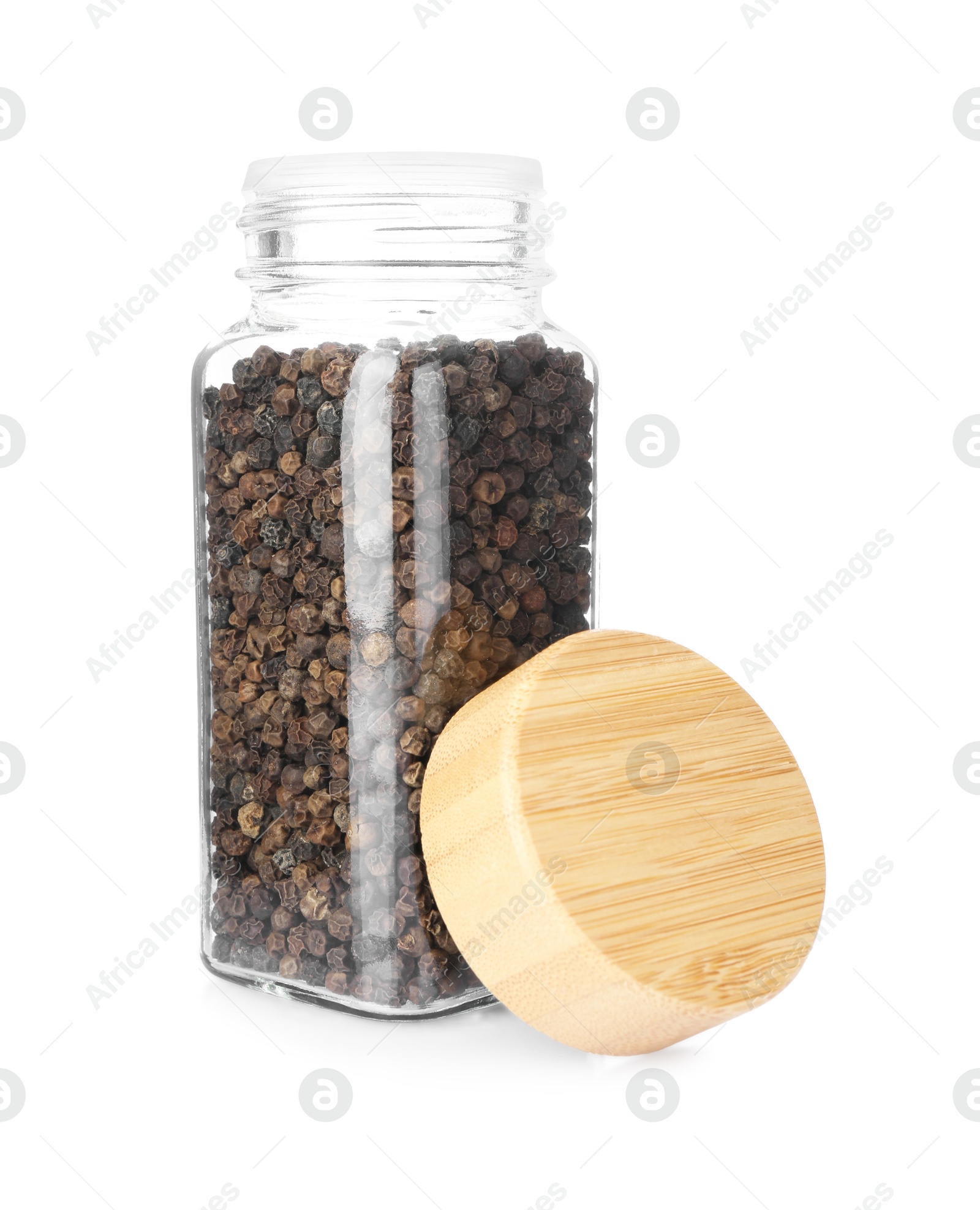 Photo of Peppercorns in glass jar isolated on white. Aromatic spice