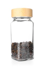 Photo of Peppercorns in glass jar isolated on white. Aromatic spice
