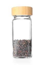 Photo of Peppercorns in glass jar isolated on white. Aromatic spice