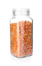 Photo of Dried carrots in glass jar isolated on white. Aromatic spice