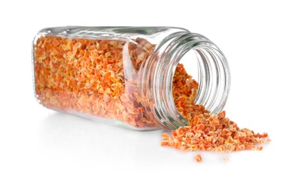 Photo of Dried carrots in glass jar isolated on white. Aromatic spice