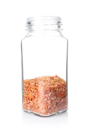 Photo of Dried carrots in glass jar isolated on white. Aromatic spice