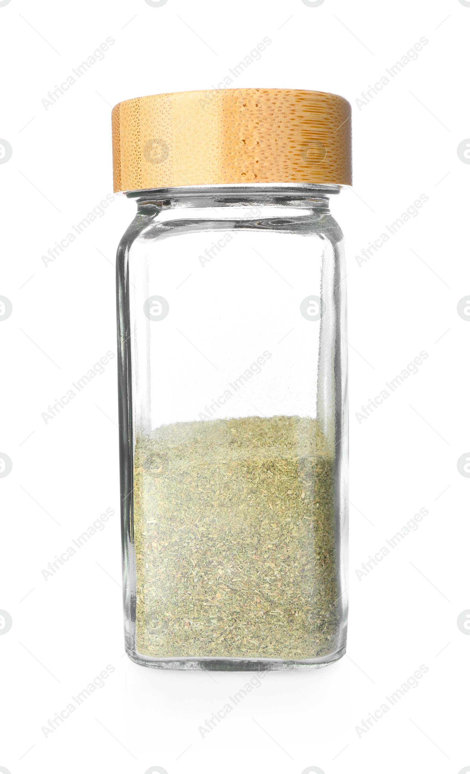 Photo of Dried basil powder in glass jar isolated on white. Aromatic spice