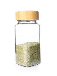 Photo of Dried basil powder in glass jar isolated on white. Aromatic spice