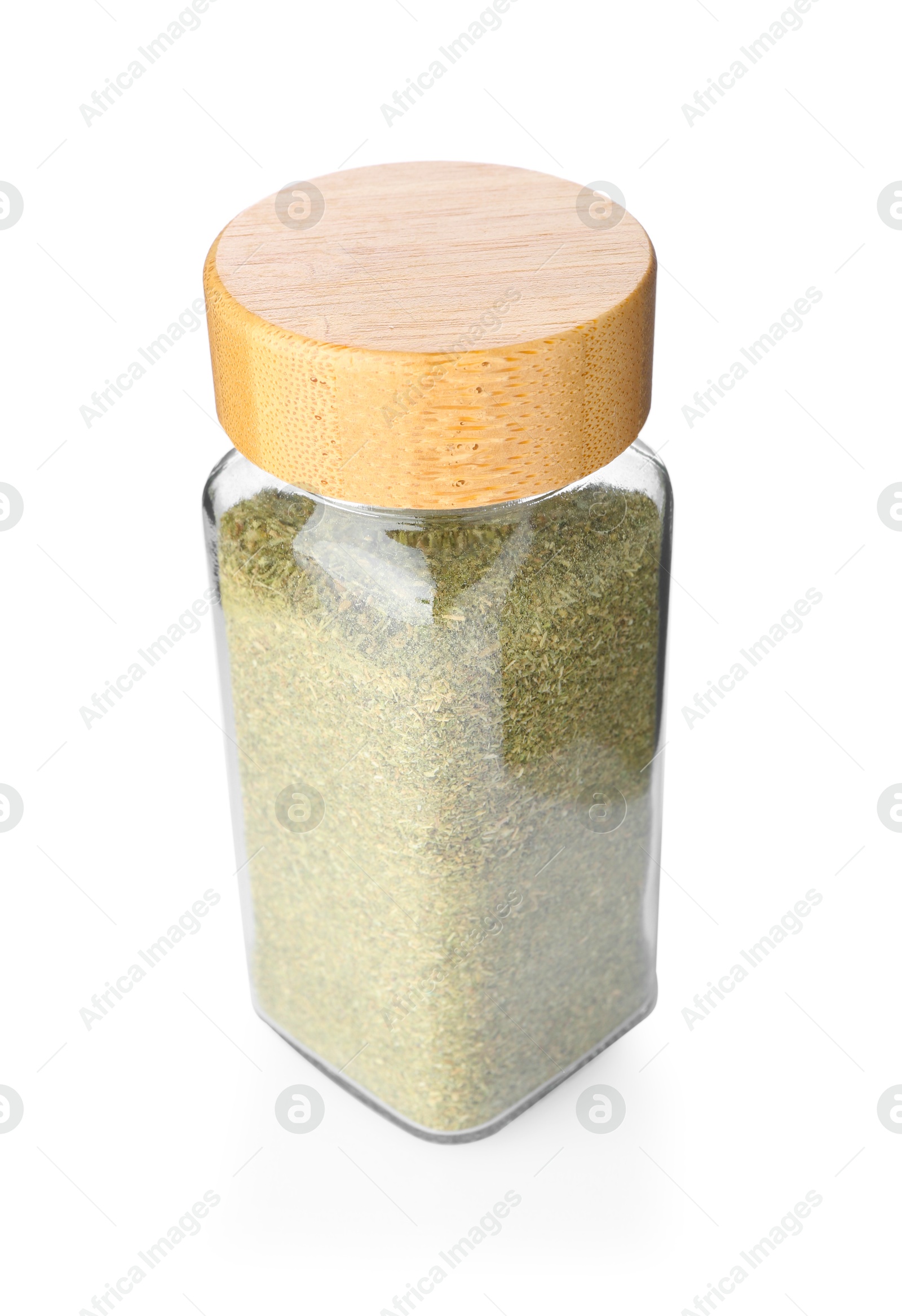 Photo of Dried basil powder in glass jar isolated on white. Aromatic spice