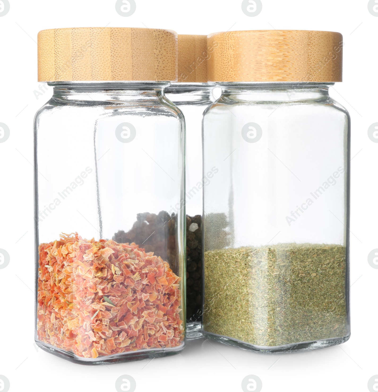 Photo of Aromatic spices in glass jars isolated on white