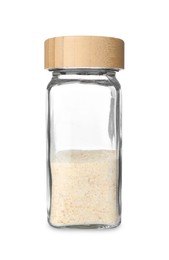 Photo of Garlic powder in glass jar isolated on white. Aromatic spice