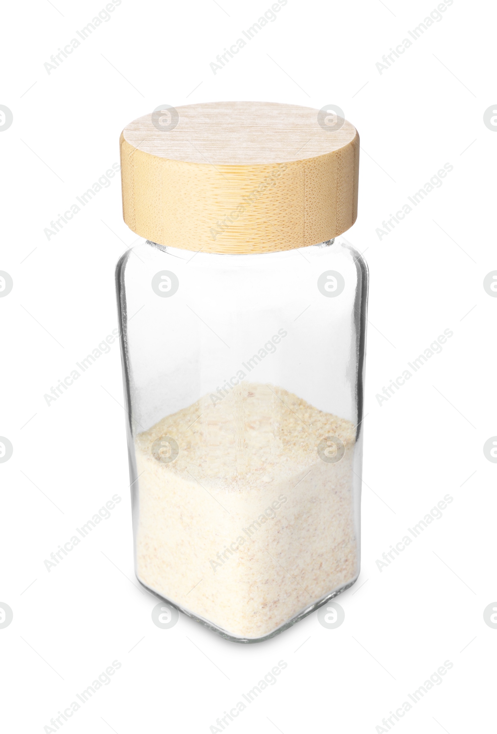 Photo of Garlic powder in glass jar isolated on white. Aromatic spice