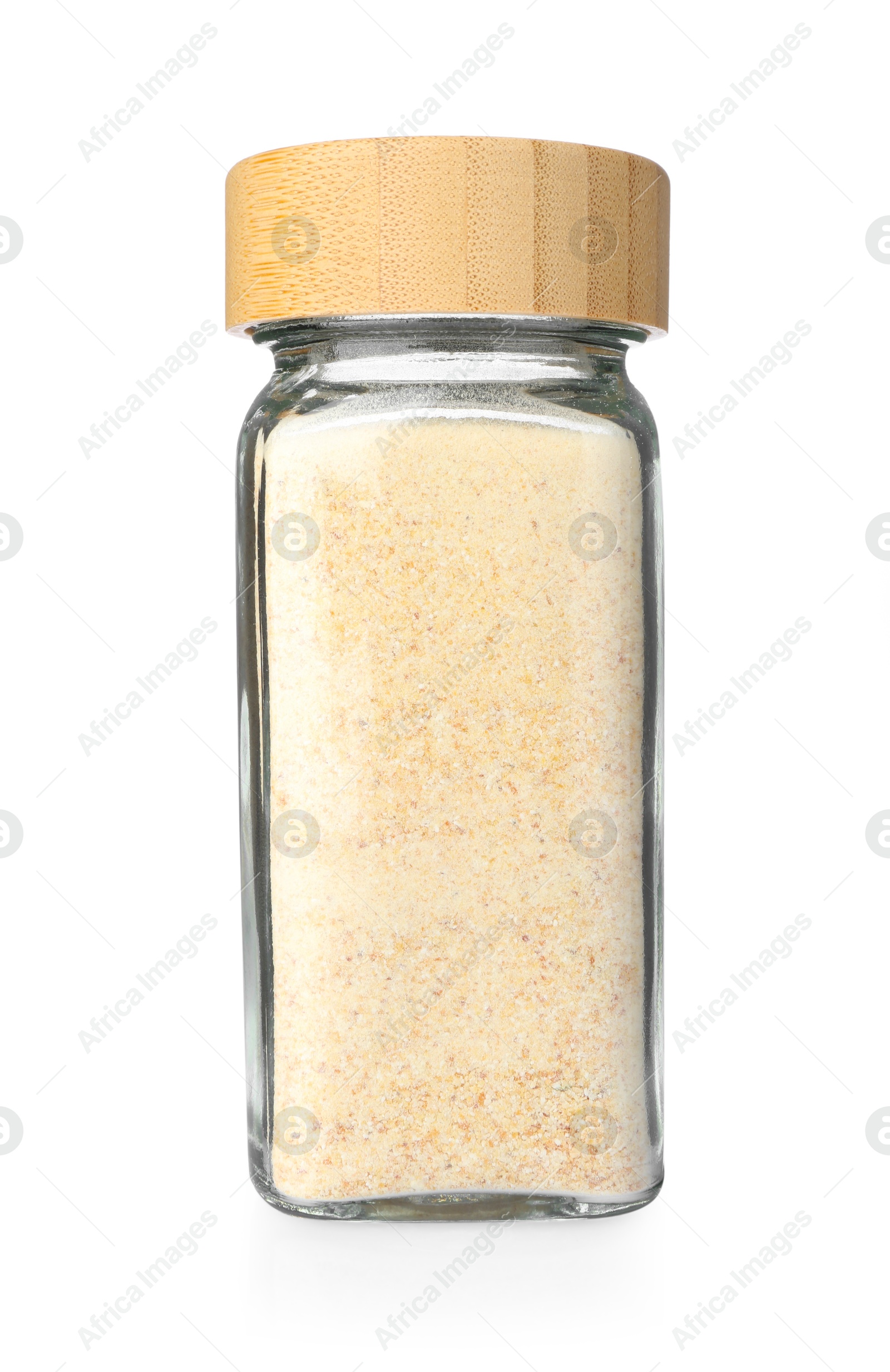 Photo of Garlic powder in glass jar isolated on white. Aromatic spice